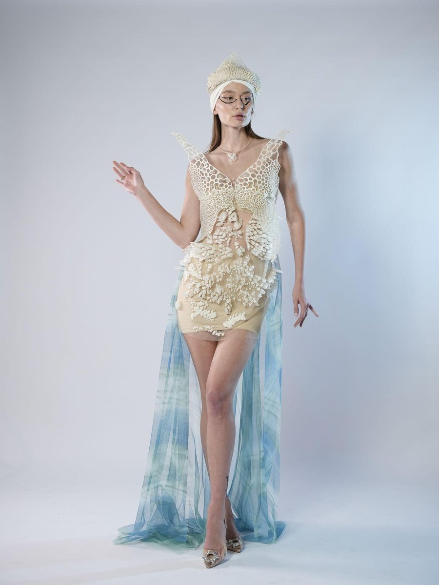 Batool Al Rashdan — pale 3D printed collar dress with long sheer blue train