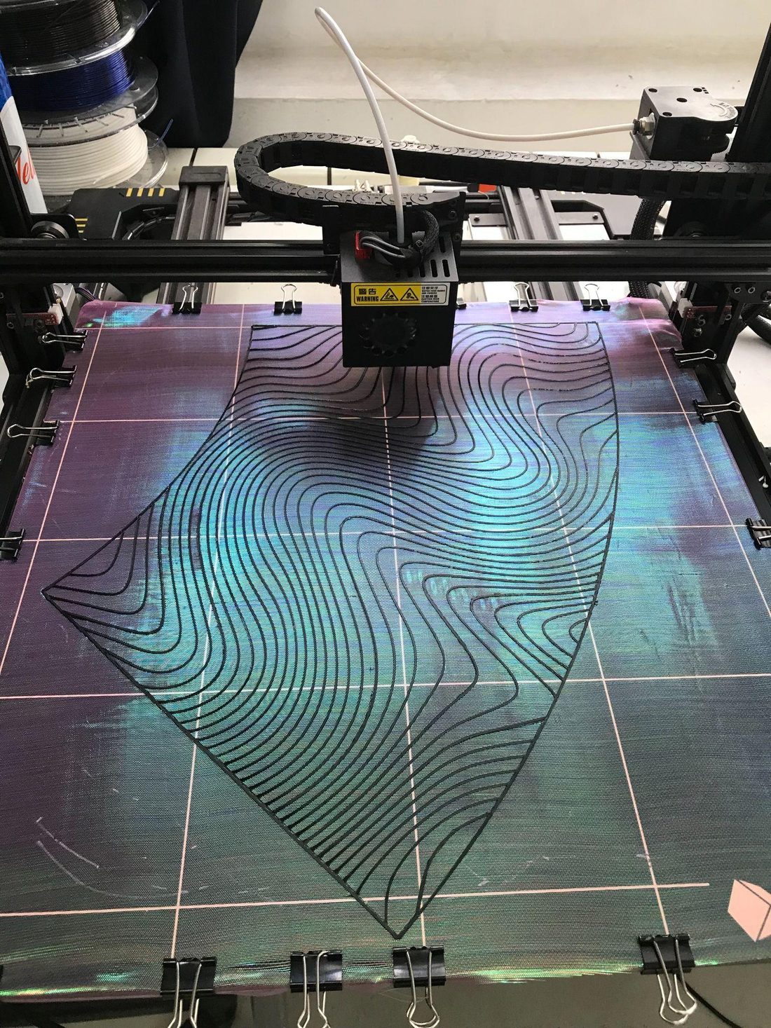 Printing Shimoiré: mesh stretched and clipped to the printer bed with TPU contours being printed onto it